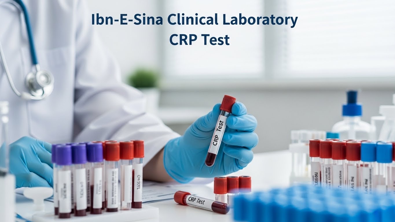 A lab technician wearing blue gloves holding a blood sample tube labeled CRP Test in a clinical laboratory at Ibn-E-Sina Clinical Laboratory, with multiple test tubes and medical equipment visible on the table.